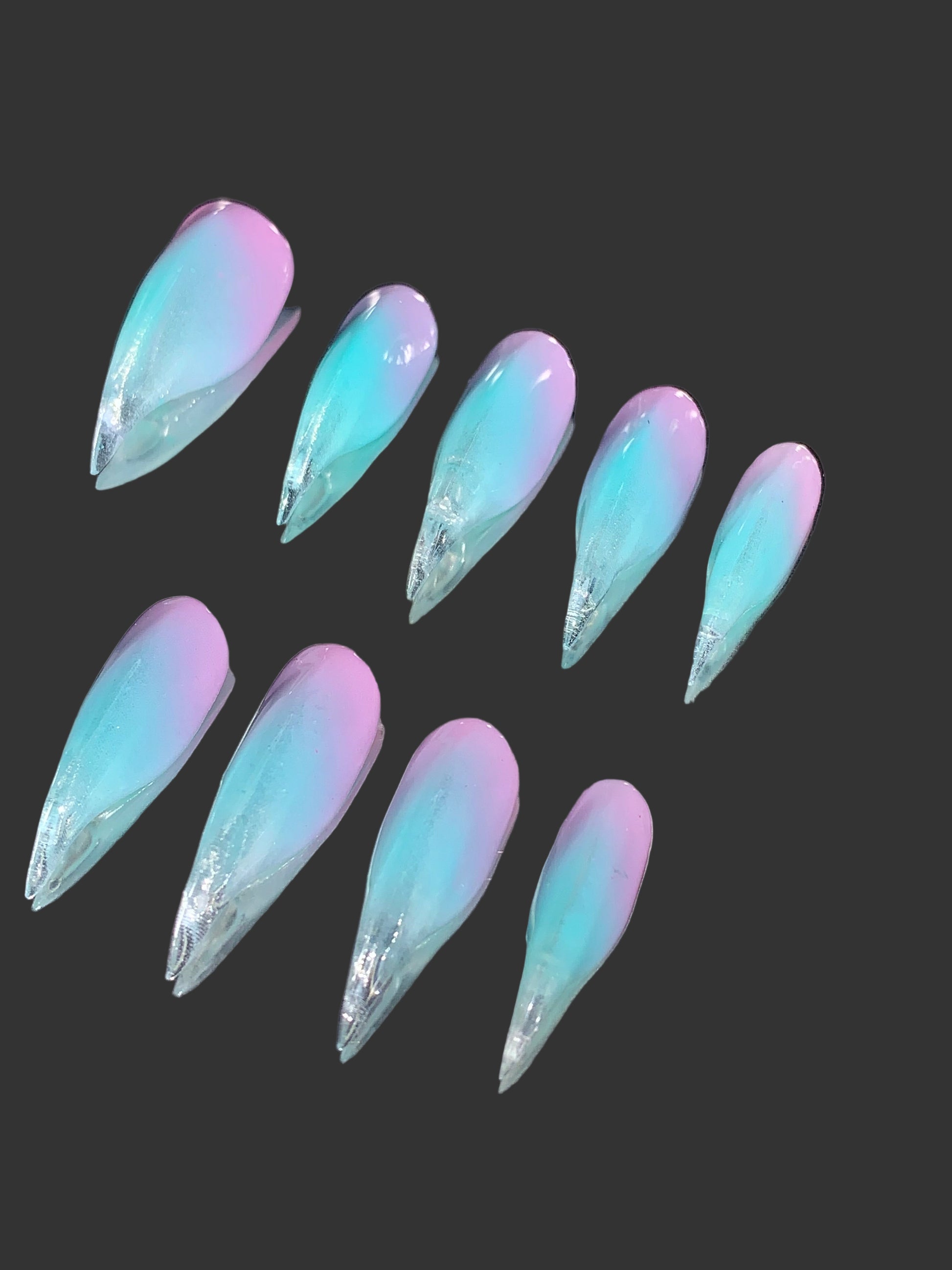Purple pink to green nails of claw shape
