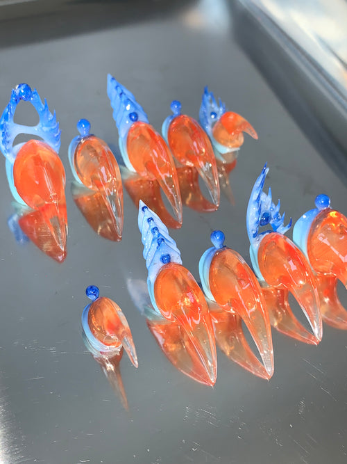 Warm golden orange & cool blue claw shape nails, inspired by sunrise over the ocean.