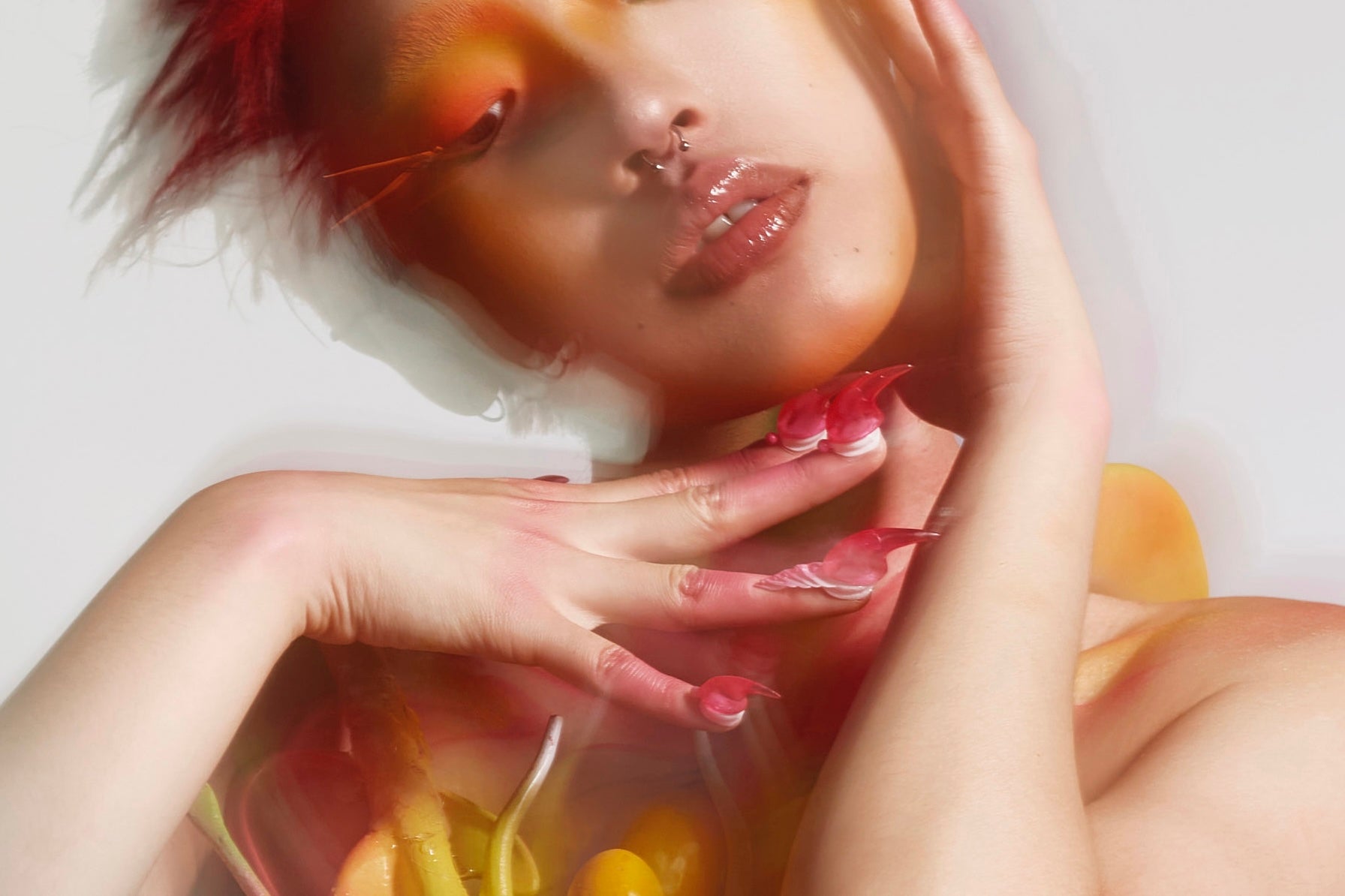 A surreal portrait of a model in fluid 3D-printed costume and sculptural nails, blending human form with biomorphic design.