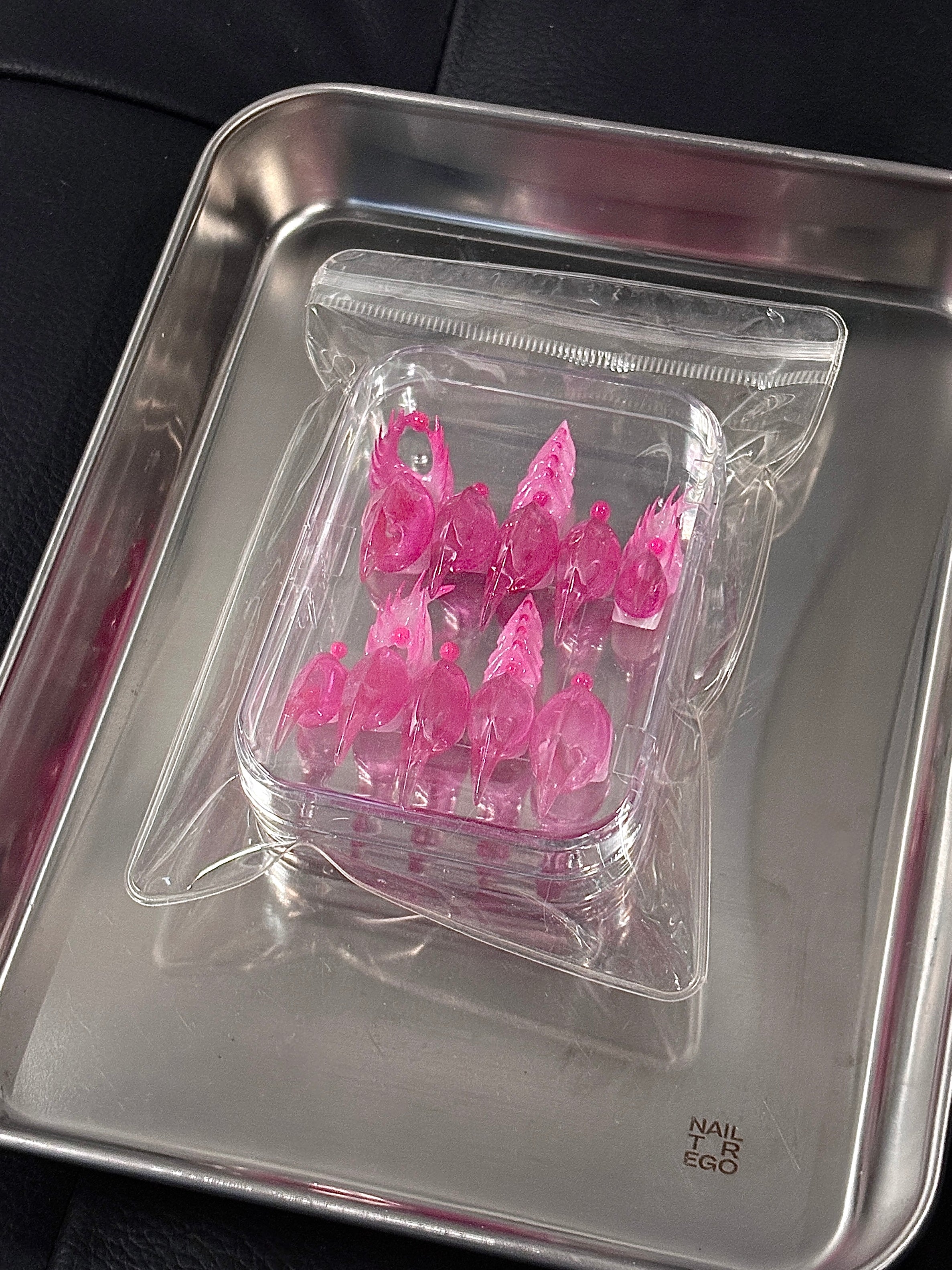 Organize nails in a acrylic storage boxes.